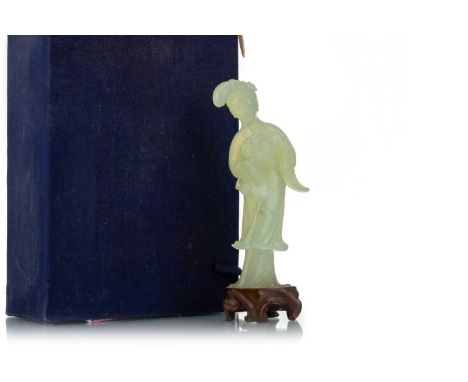 CHINESE JADE FIGURE, EARLY 20TH CENTURY modelled as a female holding a rabbit, fixed to a wooden base, in boxfigure 16cm high