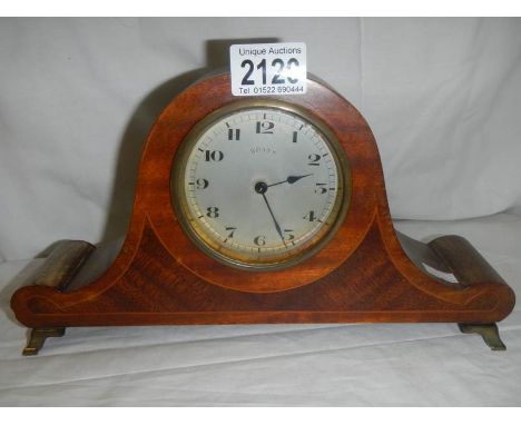 An Edwardian inlaid mantel clock.