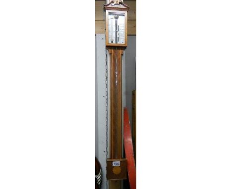 A mid 20th century Regency style stick barometer.