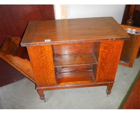 A fold over card table with pull down side and open door.