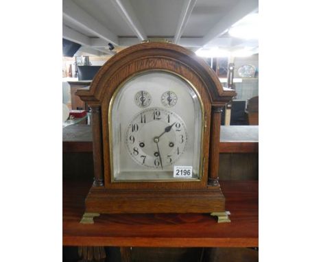 A good early 20th century oak mantel clock in full working order.
