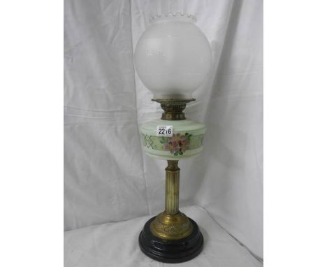 A Victorian oil lamp in good condition.