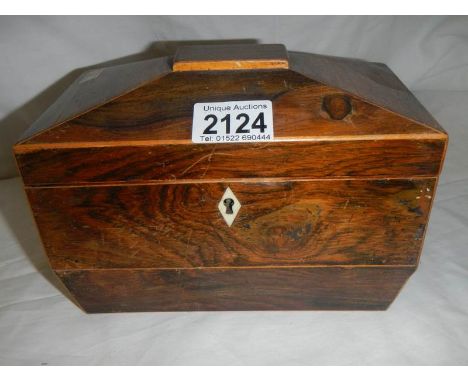 A figured mahogany caddy shaped box.