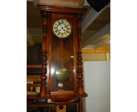 A Victorian mahogany Vienna wall clock.