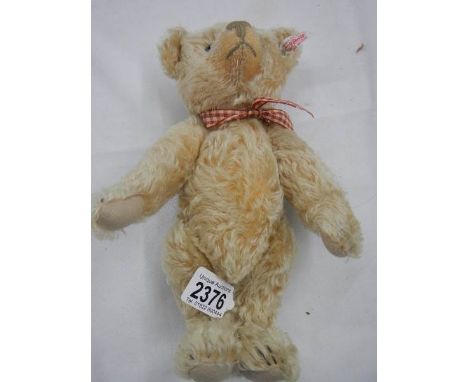 A 20th century 11" Steiff bear in good condition.