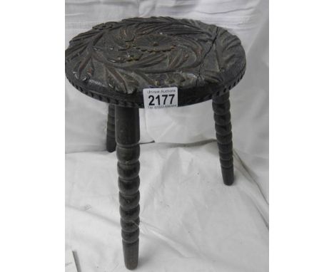 A carved stool on bobbin style legs. ****Condition report**** Height 35cm, top diameter 26cm