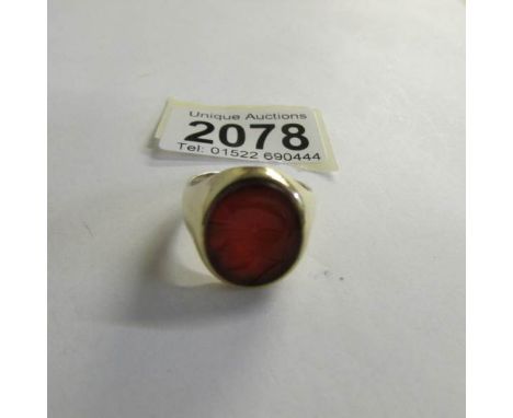 A 9ct gold Intaglio ring. size T.  10 grams with stone. ****Condition report**** Stone has fine scratches otherwise in good c