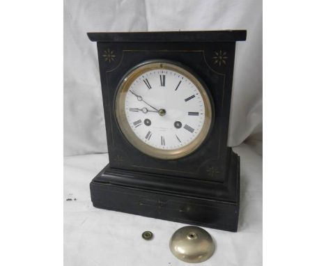 A black marble chiming mantel clock. ****Condition report**** Some small chips to casing, no key.  This heavy clock can be po
