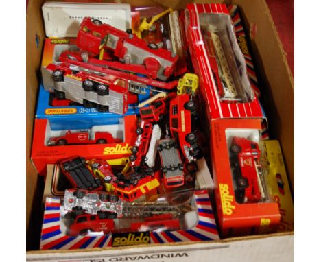 A box containing a quantity of fire engine and emergency service boxed and loose diecast figures, to include Solido and Match