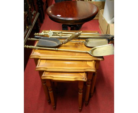 Brass fire irons, nest of occasional tables, hardwood tripod table, Edwardian single chair, and a glass topped cane conservat