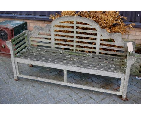 A slatted teak three seater Luytens garden bench, width 175cm