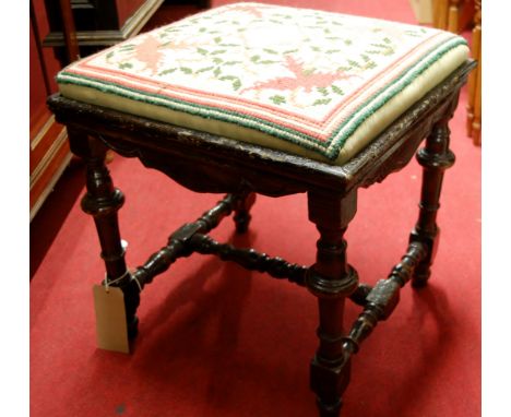 A 19th century stained fruitwood and floral tapestry embroidered dressing stool, w.47.5cm