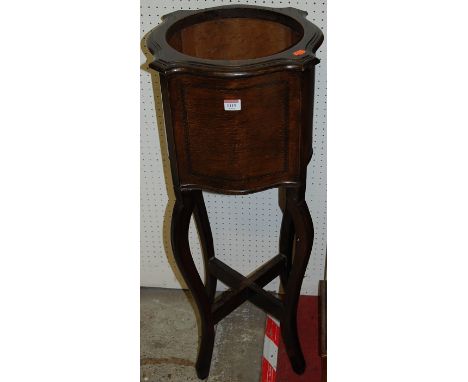 An Edwardian oak planter, of shaped form