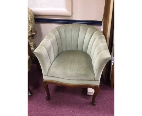 MAHOGANY FRAMED SHELL-BACKED TUB CHAIR IN THE ART DECO STYLEupholstered in pale green velour, on cabriole forelegs 