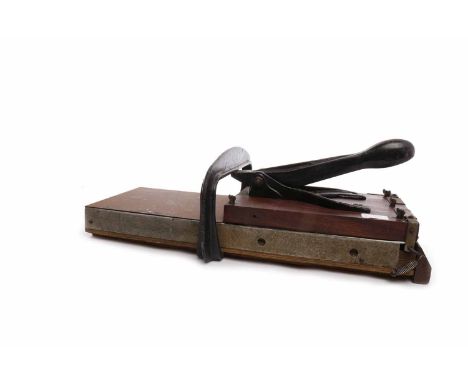 CIRCA EARLY 1950s ADANA PRINTING PRESS58cm long; together with a large selection of typefaces, contained in eight-drawer desk