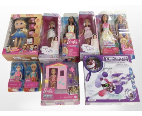 A box of Mattel Barbie dolls and a Teksta Micro Pets figure, boxed 