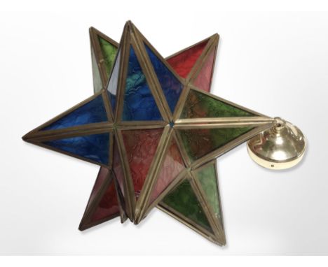 A brass and coloured glass star light shade
