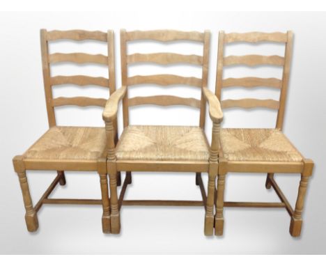 A set of six rush seated ladder backed kitchen chairs 