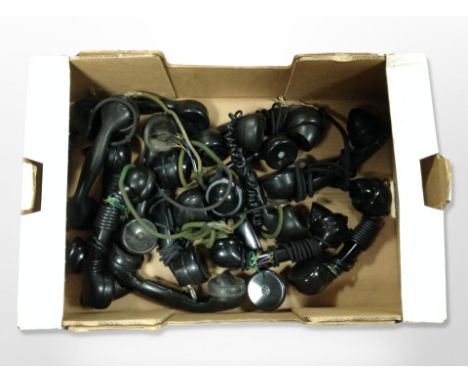 A box of vintage Bakelite telephone receivers 