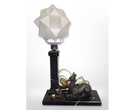 An Art Deco marble and frosted glass table lamp surmounted by a recumbent deer, height 46 cm 