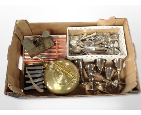 A box of brass kettle, assorted plated cutlery, set of six goblets, postal scales etc 