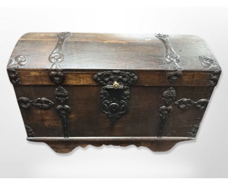 A 19th century oak iron bound dome topped trunk, width 121 cm x 65 cm deep x 83 cm high 
