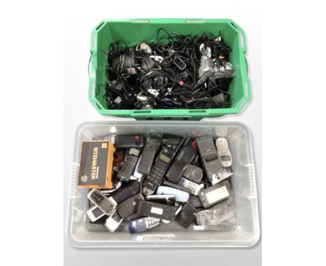 Two boxes of vintage mobile phones, car charging cables 