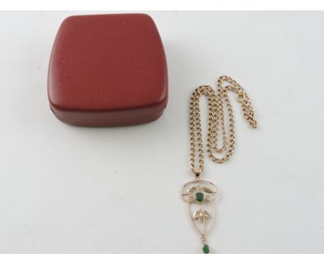 A yellow metal Belle Epoque style pendant, set with jade, on a yellow metal chain stamped 375, 11g. 