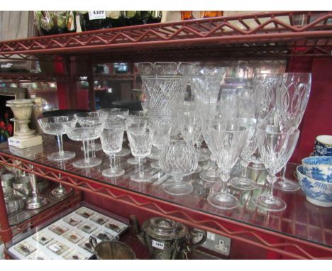 A selection of cut crystal glassware including two Stuart champagne flutes, Waterford Crystal vase and six champagne saucers 