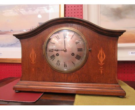 An early to mid 20th Century oak mantel clock, two train movement striking on a coiled gong, 28cm high x 41cm wide x 16cm dee
