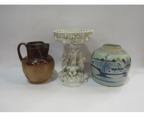 A Doulton Lambeth silver rimmed harvest jug, a Chinese blue and white ginger jar lacking cover a/f, a flatback figural compor