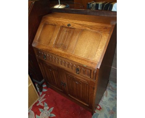 Oak Linen Fold Bureau with one drawer and cupboard ( requiring light renovation, back loose one hinge broken ) 30 inches wide