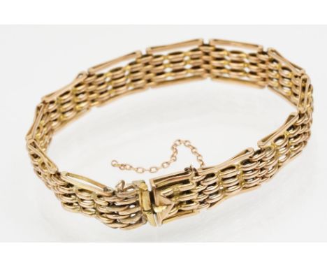 15ct rose gold gate link bracelet having a tongue in groove clasp. Marked 15. Measures 7 inches. 