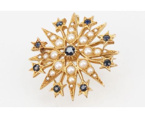 14ct gold, sapphire and pearl star brooch set with nine round cut sapphires and graduating half pearls. Hinge pin and pendant