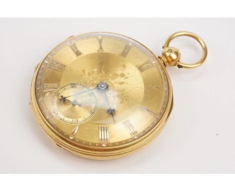18ct gold open face pocket watch having a gilt face with engine turned and floral details and subsidiary dial to six. Inner c