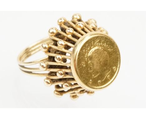 1/4 Pahlivi Iranian coin ring. The coin being set into a pierced setting with ball detailing. Ring unmarked, tests indicate h