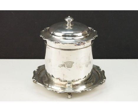 Early 20th Century silver hallmarked biscuit barrel having a pie crust rim and base with finial handle to top, raised on scro