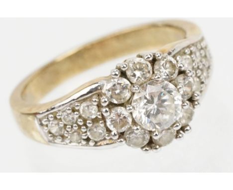 9ct gold and cz Windsor and Allen Princess Elizabeth two carat ring. The ring being set with a cluster of CZ's on a plain gol