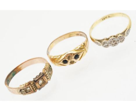 Group of three gold rings to include an 18ct and platinum three stone ring (marked 18ct, size L.5), a 9ct gold white stone ri