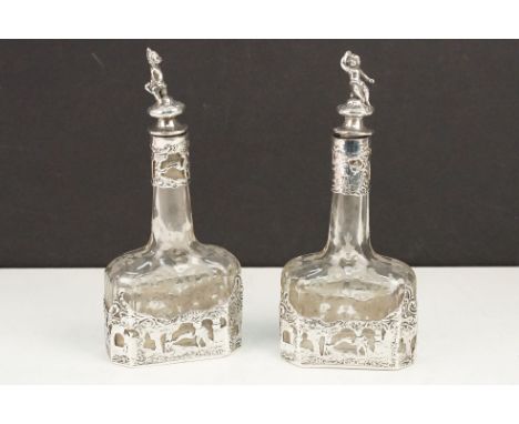 Early 20th Century continental silver vinegar bottles. The bottle having hand etched glass bottles with pierced silver casing