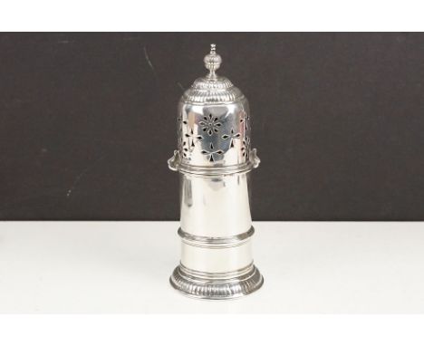 19th Century Victorian silver sugar sifter having a pierced top with gadrooned finial top and base. Hallmarked London 1928, W