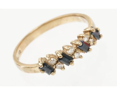 9ct gold sapphire and diamond ring. The ring being set with four step cut sapphires and six round brilliant cut diamonds. Hal
