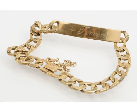 9ct gold identification bracelet with flat curb links and safety chain. Hallmarked London 1988. Bracelet measures 8 inches. 