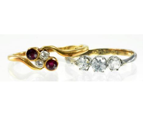 A RUBY AND DIAMOND CROSSOVER RING IN GOLD MARKED 18CT AND ANOTHER GOLD RING, 3.6G