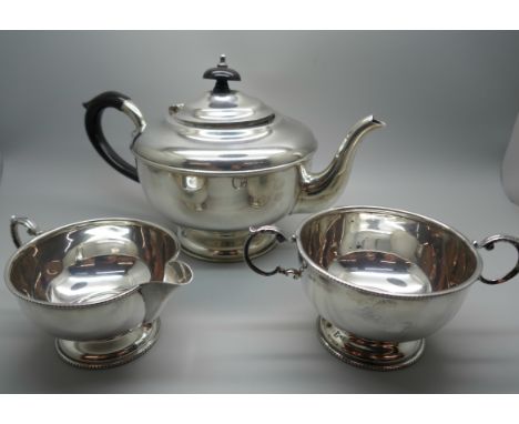 A three piece silver tea service, Birmingham 1958, 627g 