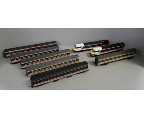 OO gauge model rail, six coaches, a dummy car and a motor car 