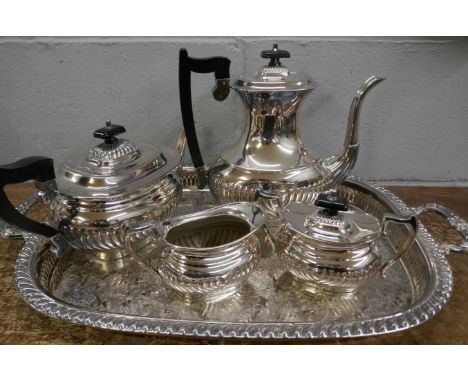 A four piece silver platd tea service and two handled gallery tray 