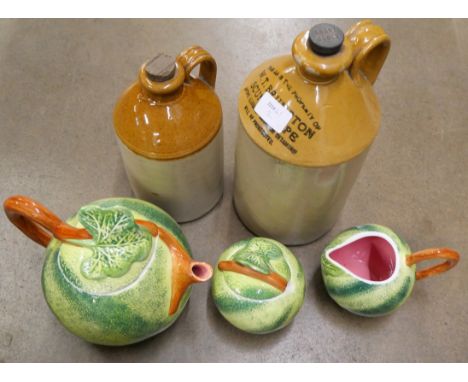 A Peir 1 Imports three piece tea service, the sugar bowl lid with chip, two stoneware flagons, printed mark W.T. Bumpton, Scu