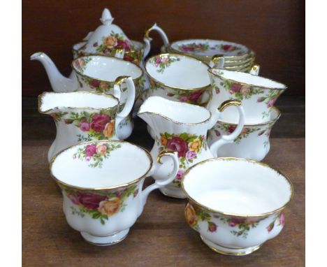 A Royal Albert Old Country Roses tea set, seven cups and saucers, six tea plates, teapot, two creams and one sugar bowl **PLE