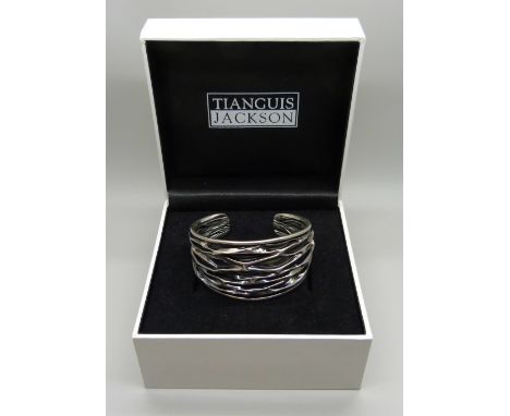 A Tiangius silver Brutalist style bangle, 31g 